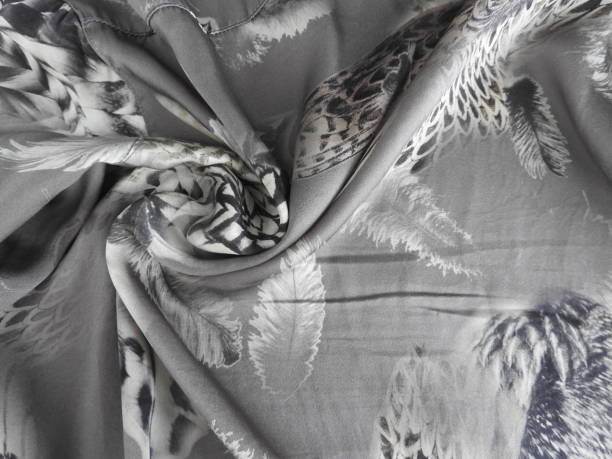 Smooth satin silk with grey feathers, texture
