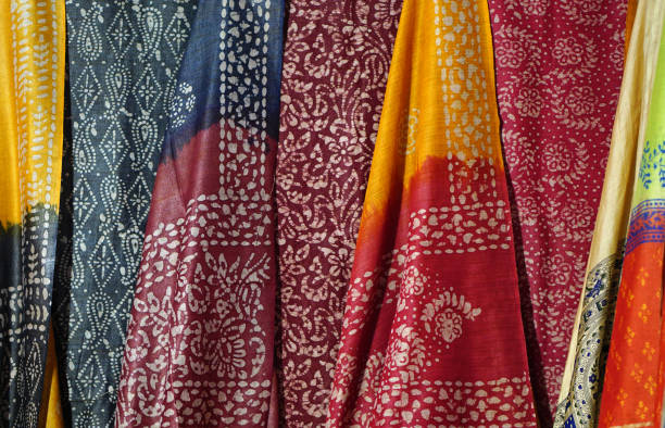 Indian woman sarees or saris in retail display in a market