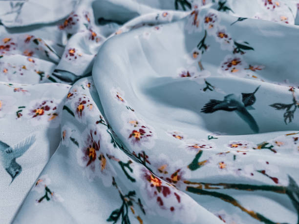 A closeup shot of nice bed sheets with flowers