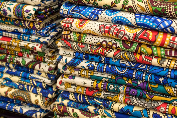 Rolls of textile, cloth and tissue of various colours on the market